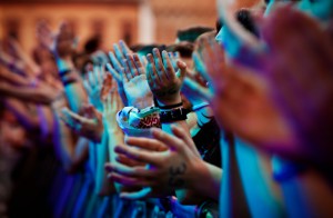 Clapping hands of the audience of a modern music concert